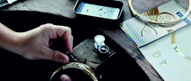 Goldsmith at work on the piece of jewellery